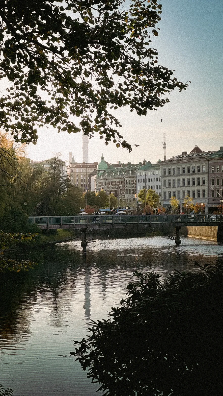 Buildings and a bridge reflected in a Gothenburg canal