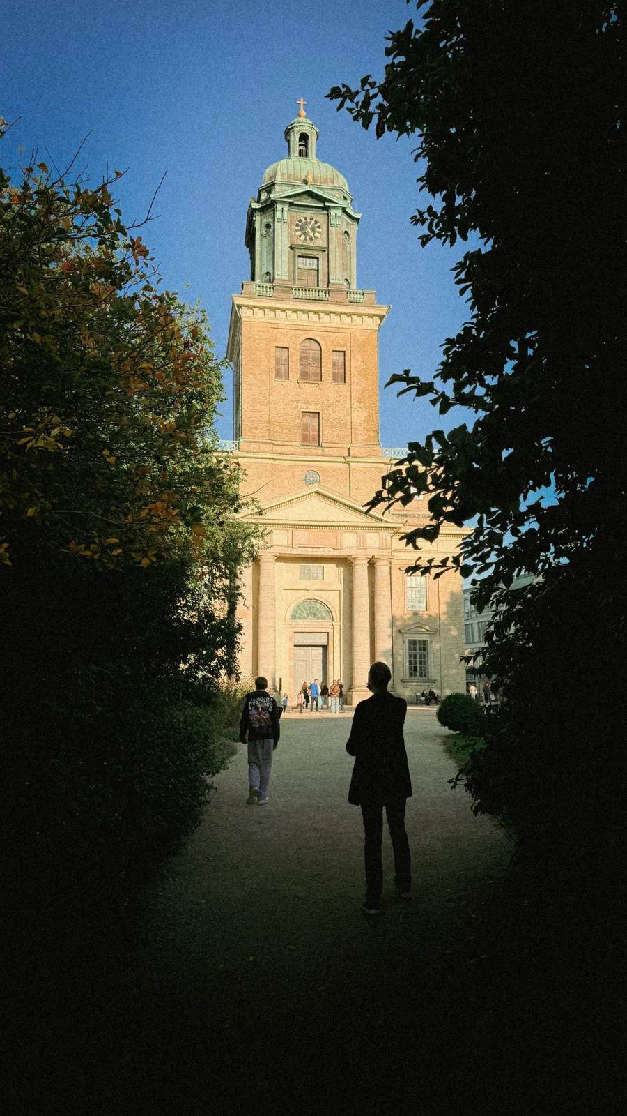 Church tower framed by trees in Gothenburg